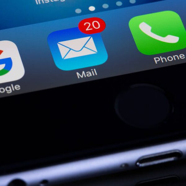 iPhone screen close-up showing the Apple Mail app icon.