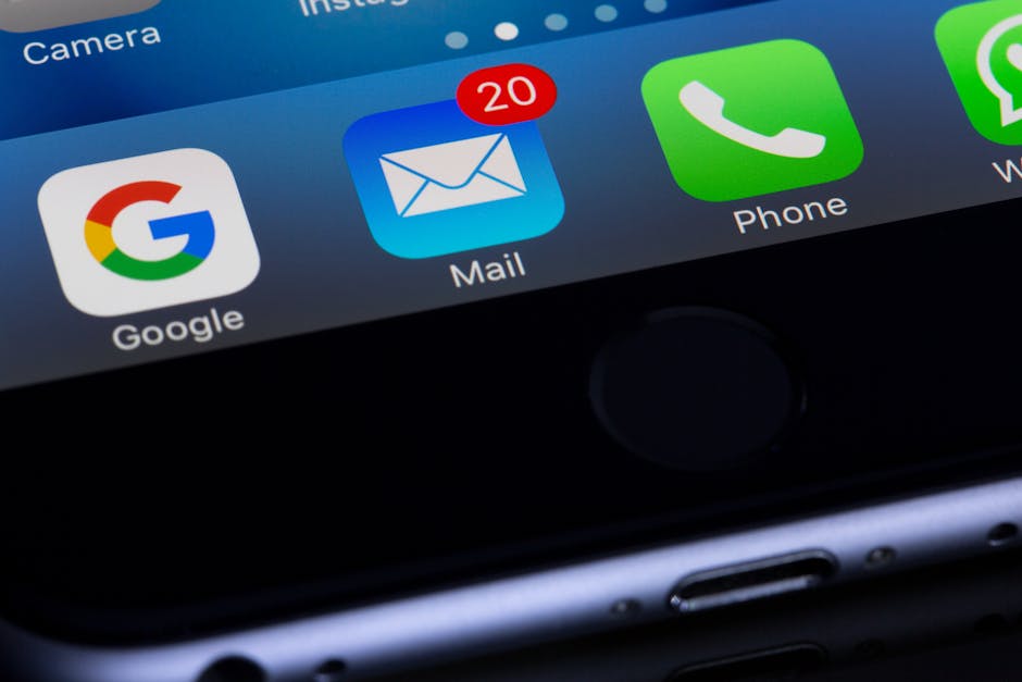 iPhone screen close-up showing the Apple Mail app icon.