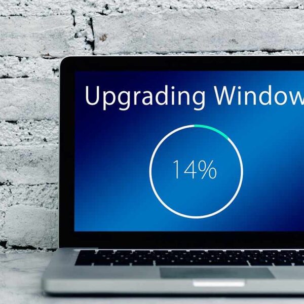 Laptop screen showing the Windows 11 upgrade progress bar using Rufus on a Windows 10 PC