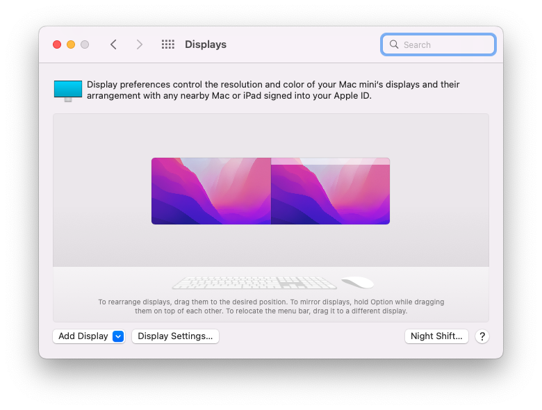 macOS-Display-Settings-with-Two-Monitors macOS 12 Displays settings showing a MacBook and external monitor arranged side by side.